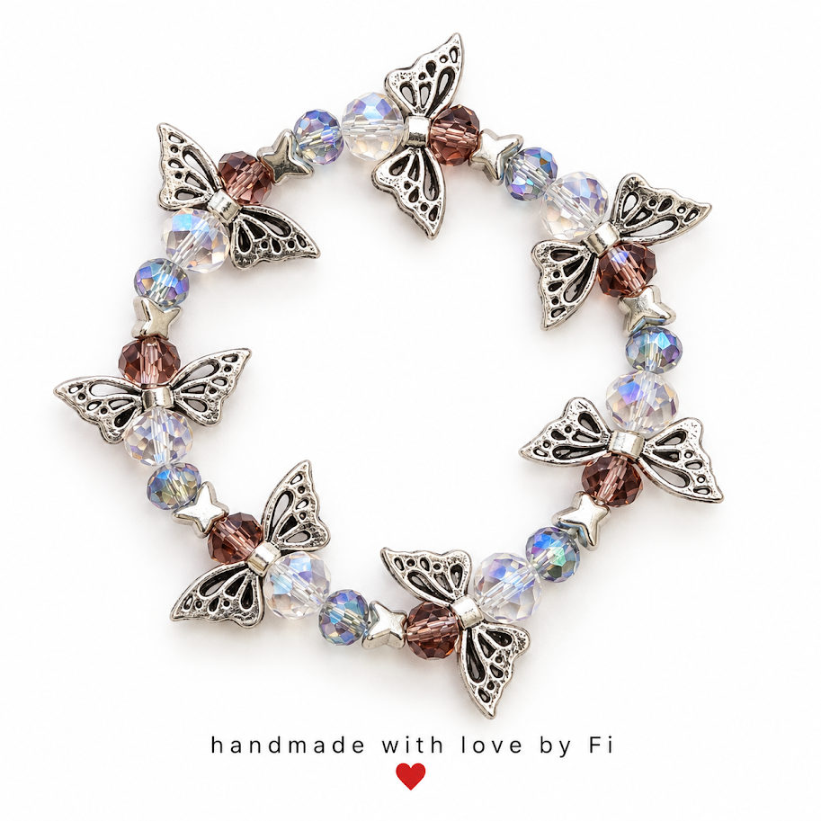Silver-tone butterfly and star bracelet with clear iridescent and smoky purple faceted beads