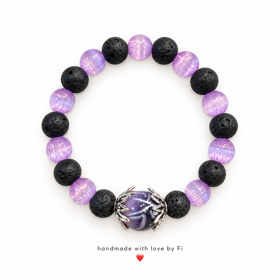 Handmade bracelet with black lava-style beads, lavender beads and a purple dragon-claw statement centre