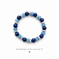 Lapis lazuli and aqua blue faceted rondelle bracelet with silver metal spacers handmade by Fi
