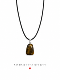 Tiger's eye tumbled freeform pendant necklace on black wax cord with silver bail handmade by Fi