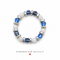 White cat's eye and sapphire blue crystal bracelet with silver metal rondelle spacers handmade by Fi