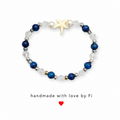 Navy blue and crystal starfish bracelet with cream ceramic starfish focal bead and white pearl accents handmade by Fi