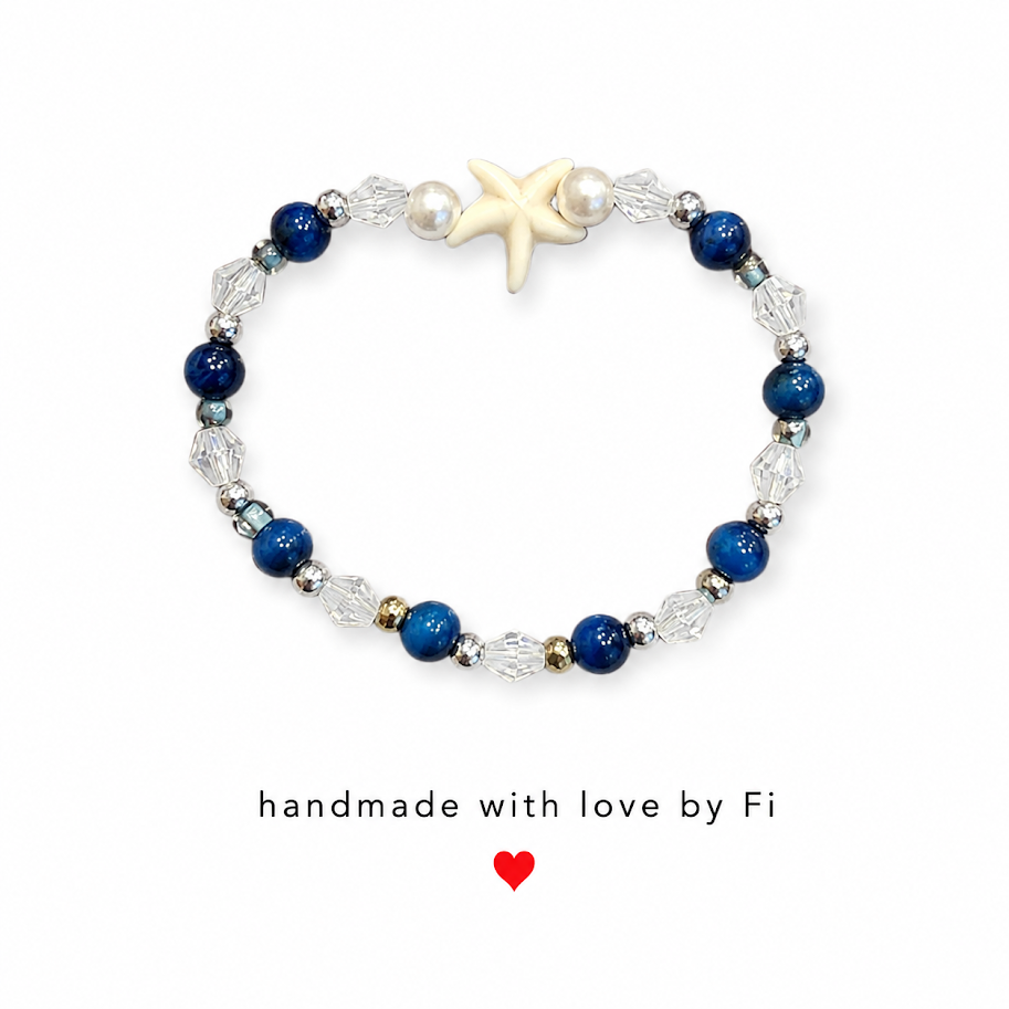 Navy blue and crystal starfish bracelet with cream ceramic starfish focal bead and white pearl accents handmade by Fi