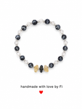 Snowflake obsidian and clear crystal bracelet with citrine and onyx accent chips handmade by Fi
