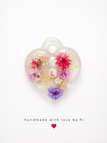 Personalised initial dried flower resin heart pendant with pink lilac and purple flowers gold leaf and glitter handmade by Fi