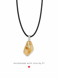 Golden citrine tumbled freeform pendant necklace on black wax cord with silver bail handmade by Fi