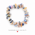 Handmade bracelet with ocean blue, peach, blush pink, clear and smoky grey gemstone-style chip beads