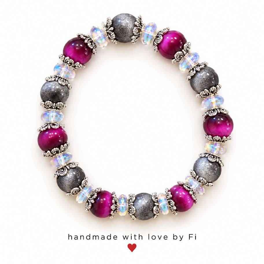 Magenta and textured charcoal grey bracelet with iridescent beads and ornate silver-tone bead caps