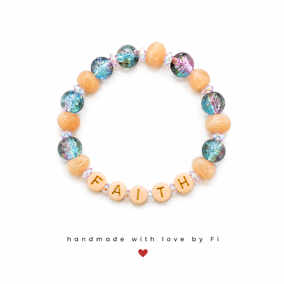 FAITH word bead bracelet with iridescent galaxy beads and pink crystal spacers handmade by Fi