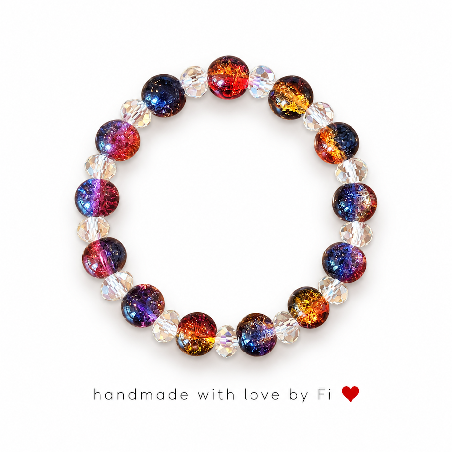 Handmade galaxy crackle glass bracelet with red, orange, blue and purple beads and clear crystal spacers