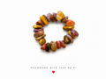 Chunky mookaite jasper tumbled chip stretch ring in earthy mustard yellow orange red olive and lilac tones handmade by Fi
