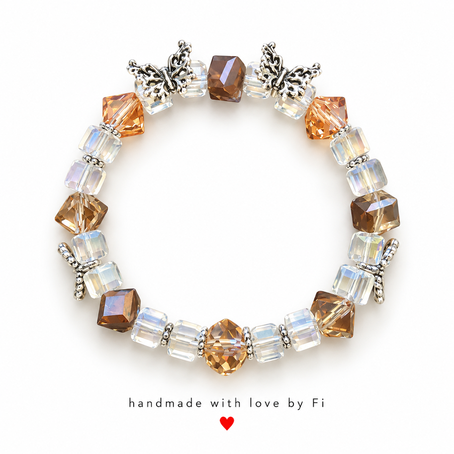 Amber and clear faceted beaded bracelet with silver-tone butterfly accents