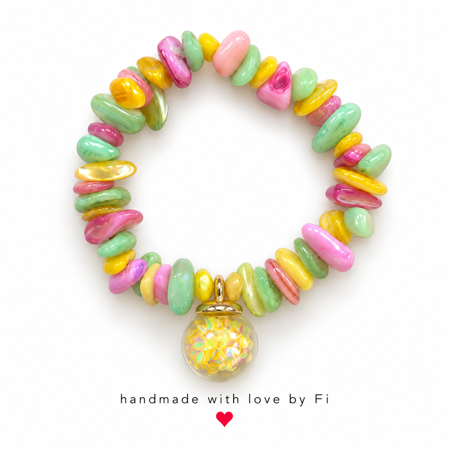 Pink, green and yellow chip bead bracelet with a clear dangling charm