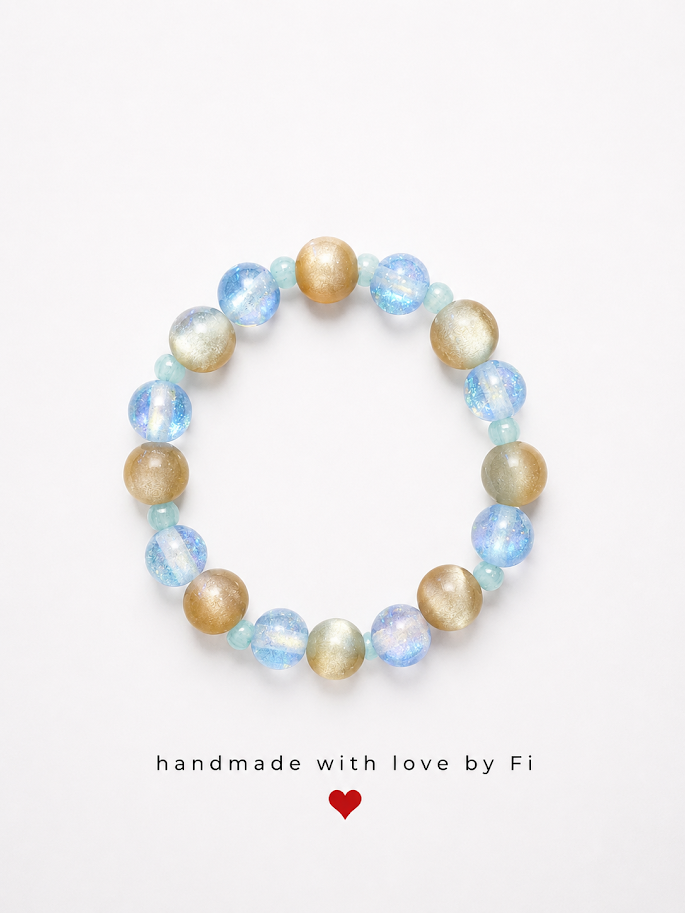 Blue crackle glass and golden cat's eye bracelet with soft aqua glass beads handmade by Fi