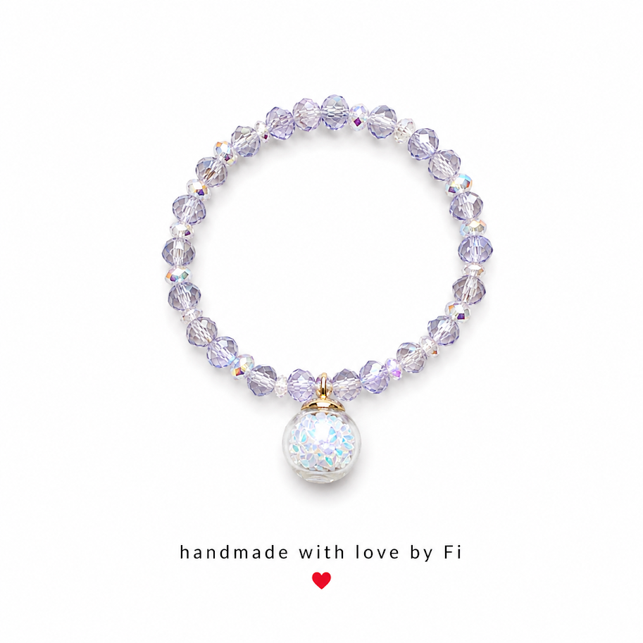 Grey lilac AB crystal bracelet with holographic iridescent confetti globe charm and gold bail handmade by Fi