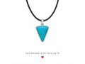 Turquoise howlite cone pendant necklace on black wax cord with silver bail handmade by Fi