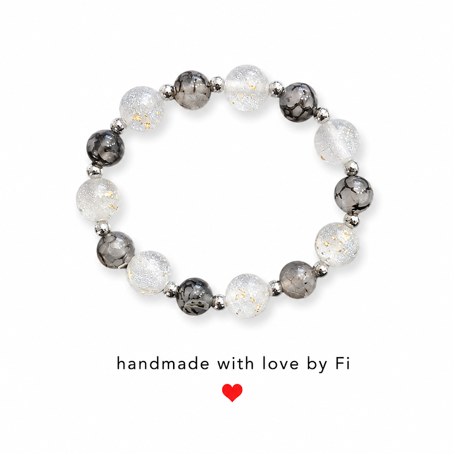 Frosted white and charcoal crackle bead bracelet with gold leaf shimmer and silver spacers handmade by Fi